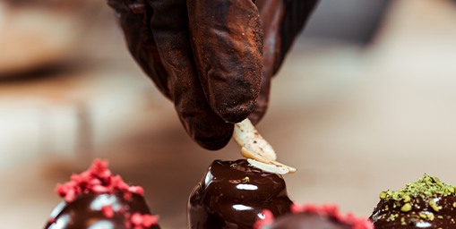 Chocolatier hand-finishing a chocolate